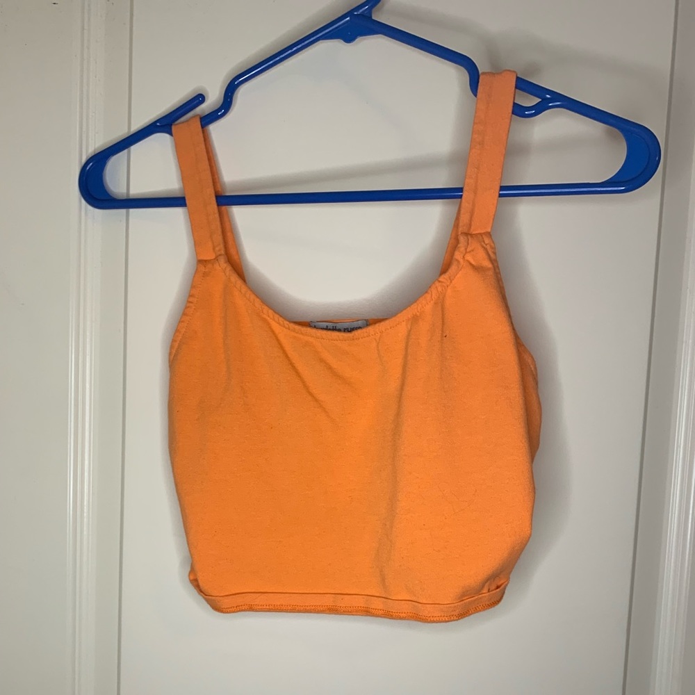 orange cropped charlotte rouse shirt